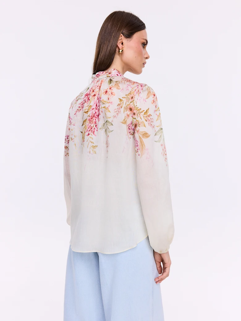 Creamy shirt with a stand-up collar and floral patterns