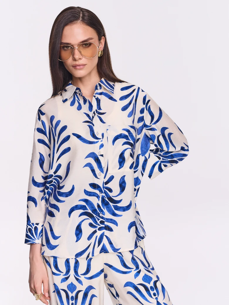 White oversized shirt with an ornamental pattern