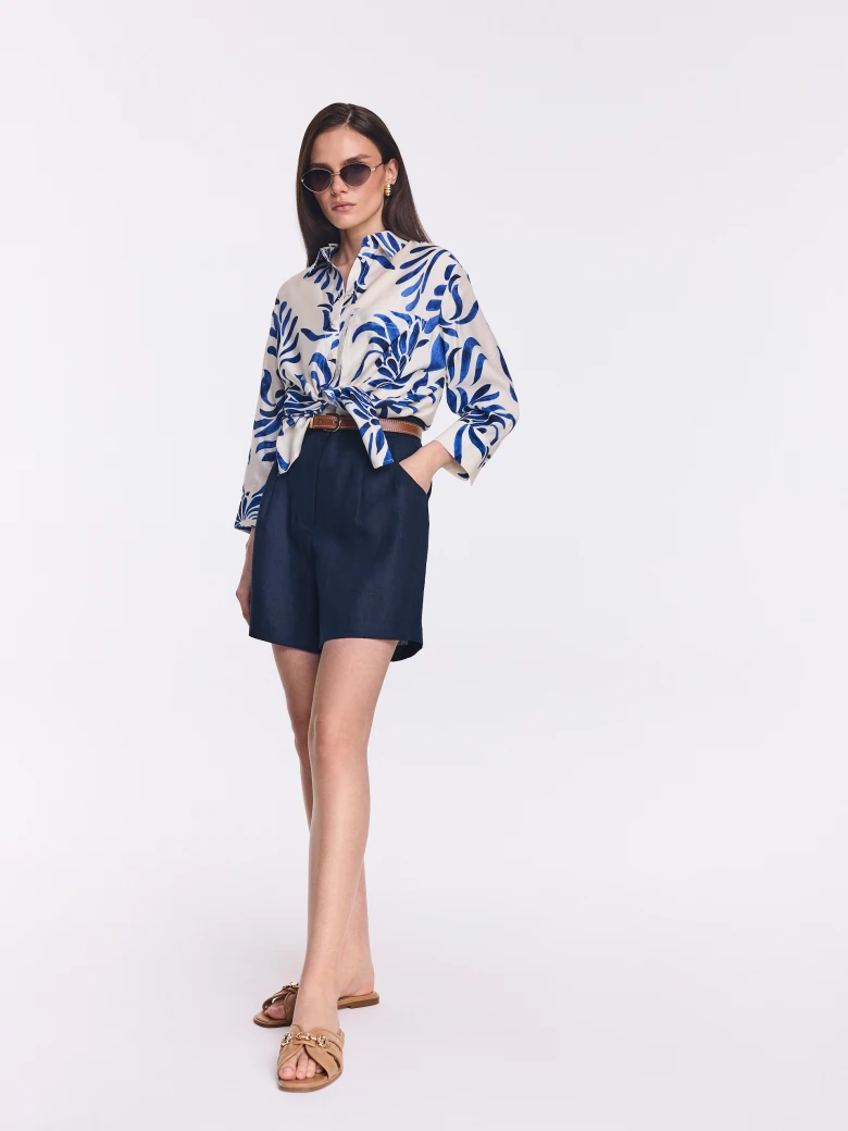 White oversized shirt with an ornamental pattern