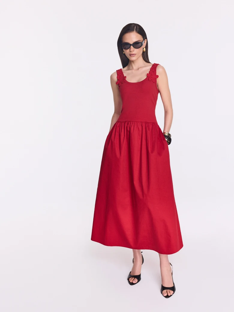Red midi dress with decorative straps