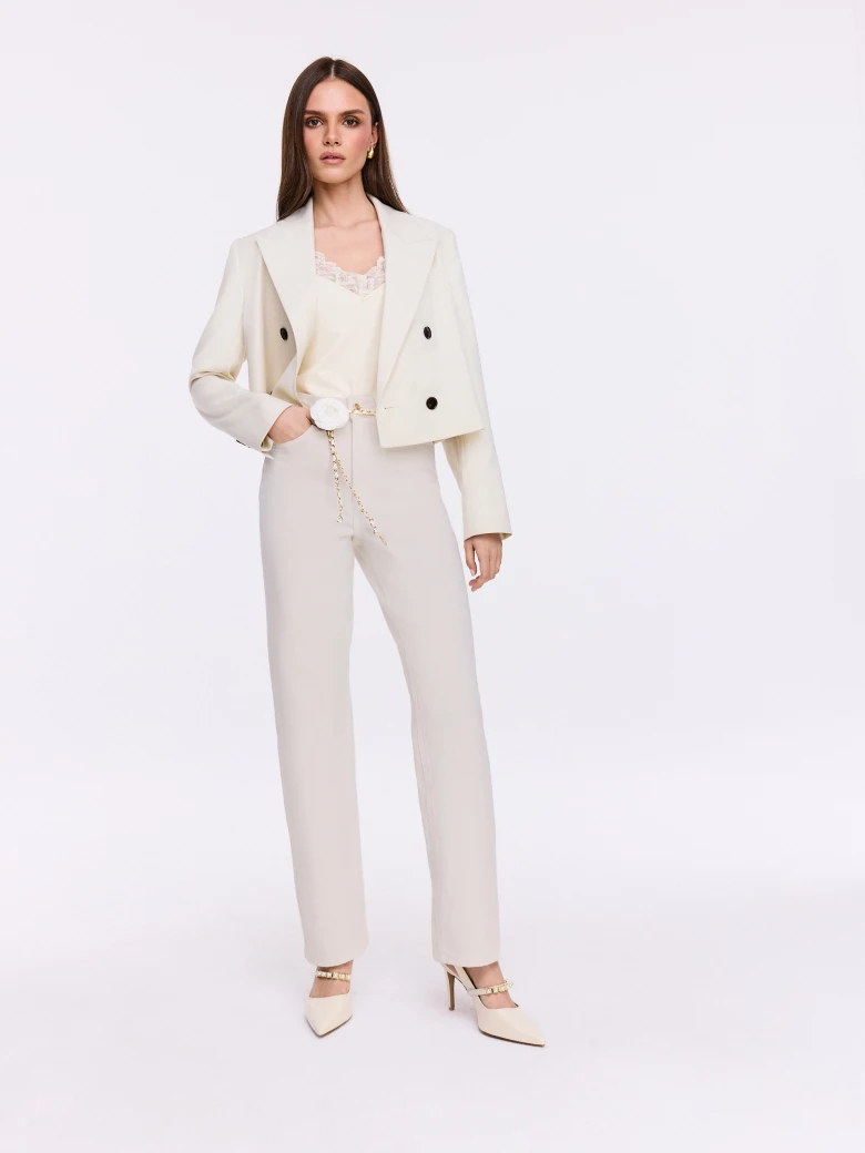 Simple cream jeans with a decorative belt