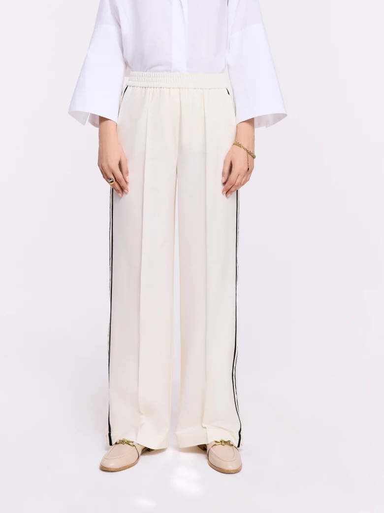 Cream pants with black piping