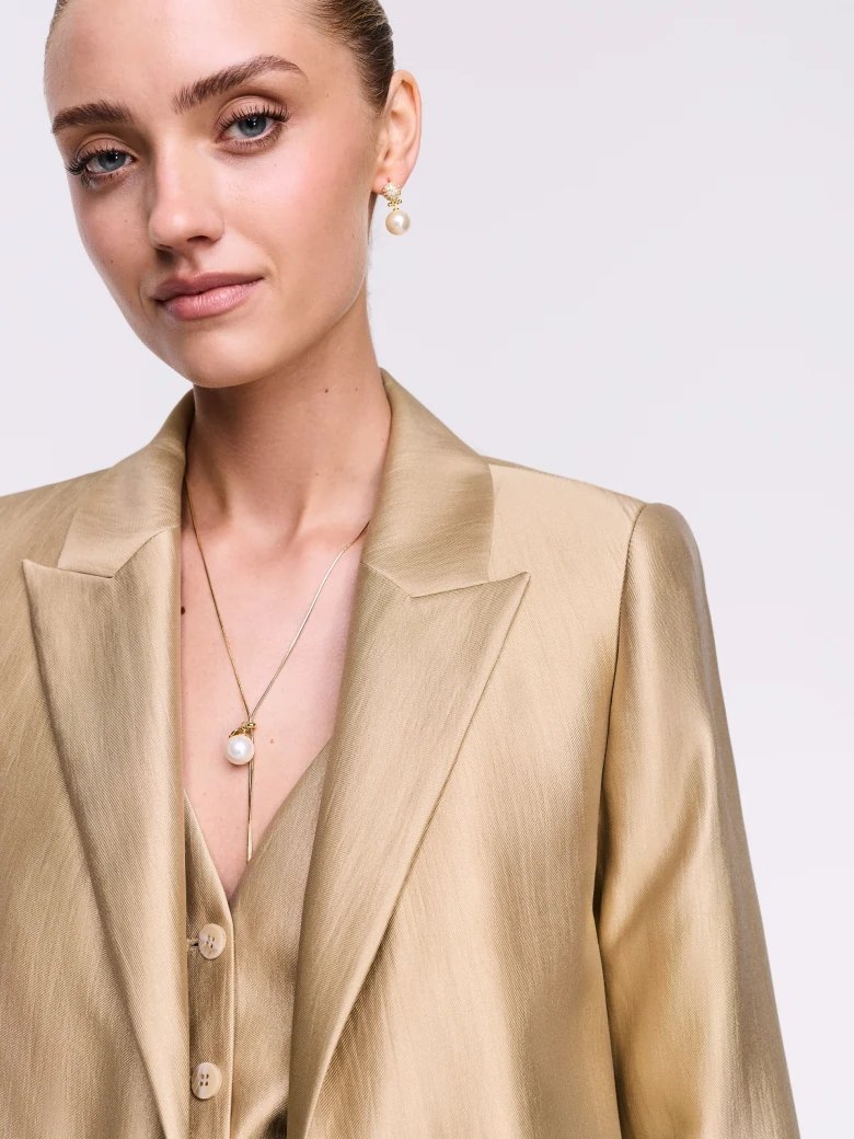 A gold-toned blazer
