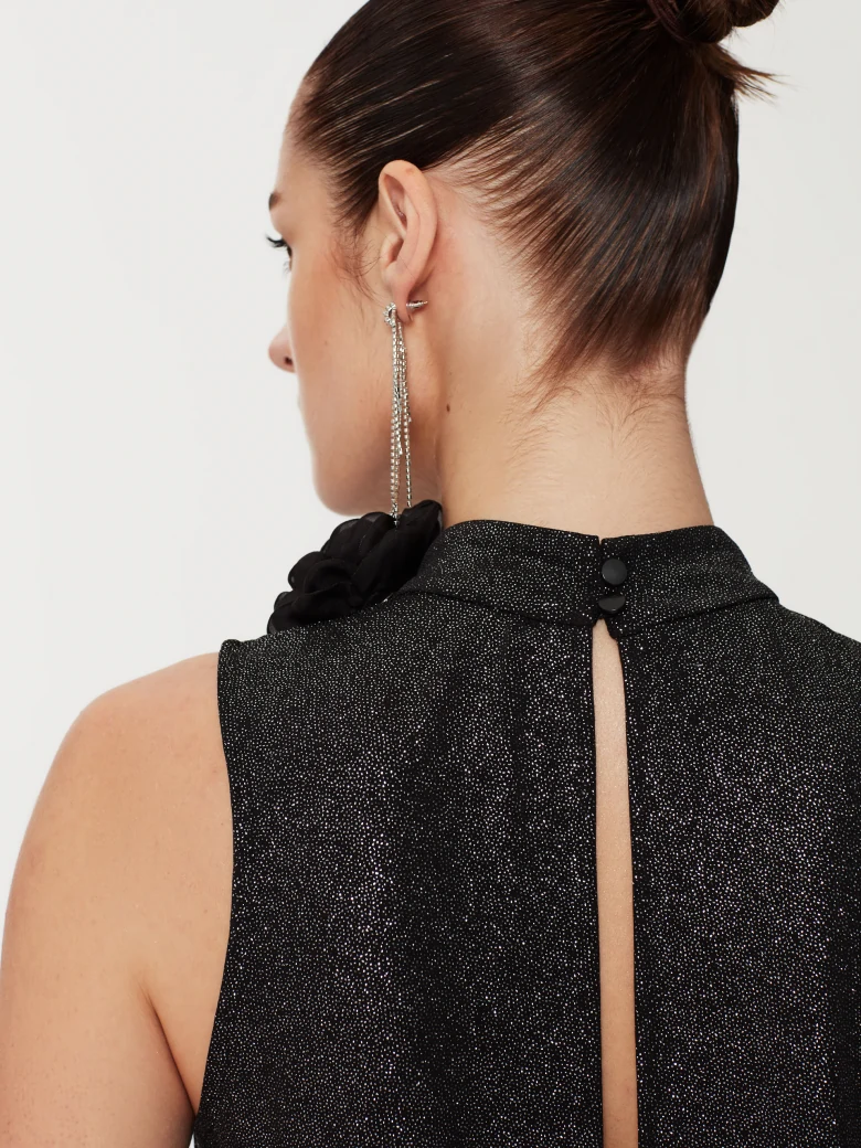 Black blouse in shiny material