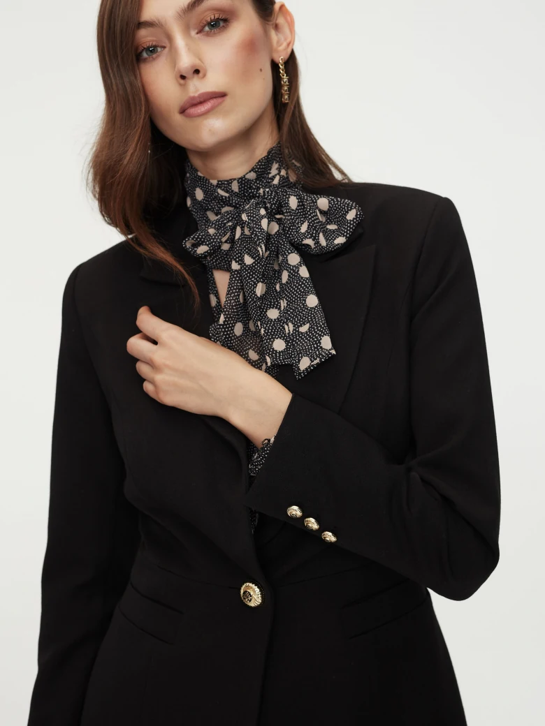 Black jacket with golden button