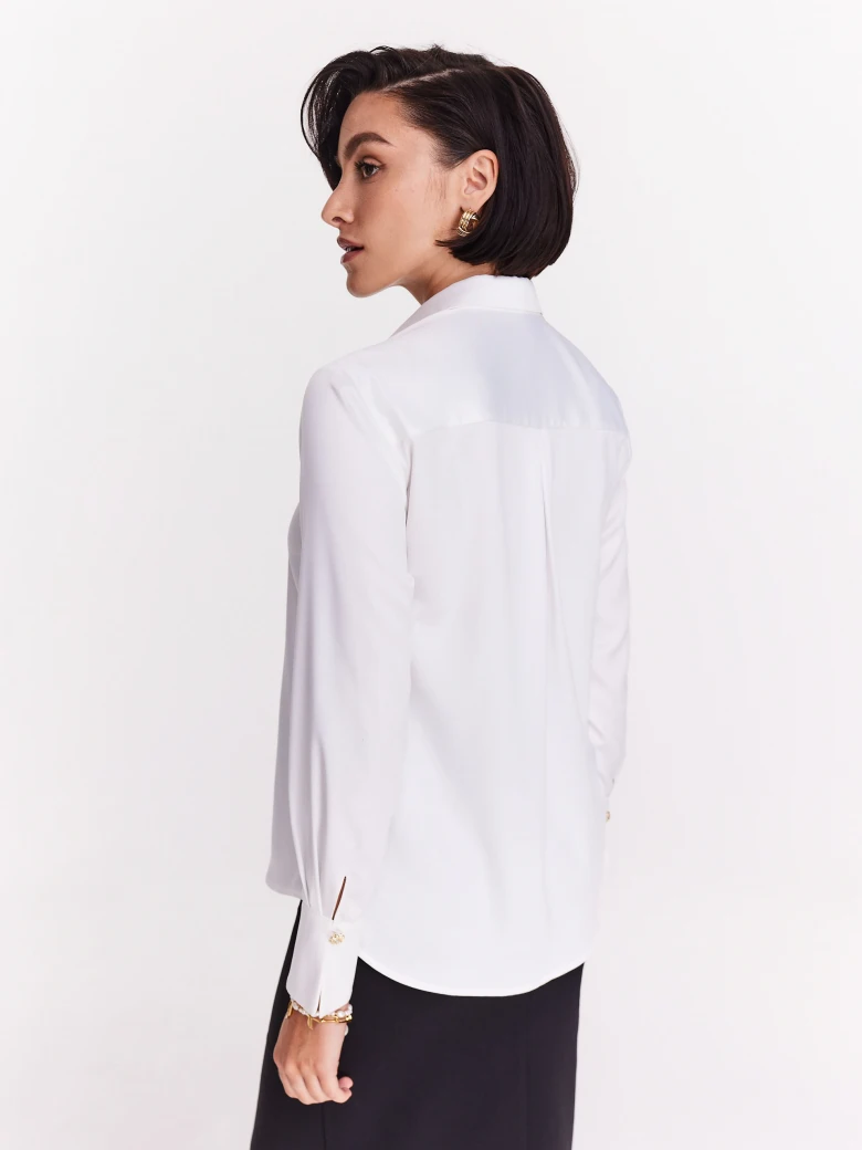 Elegant white shirt with decorative buttons