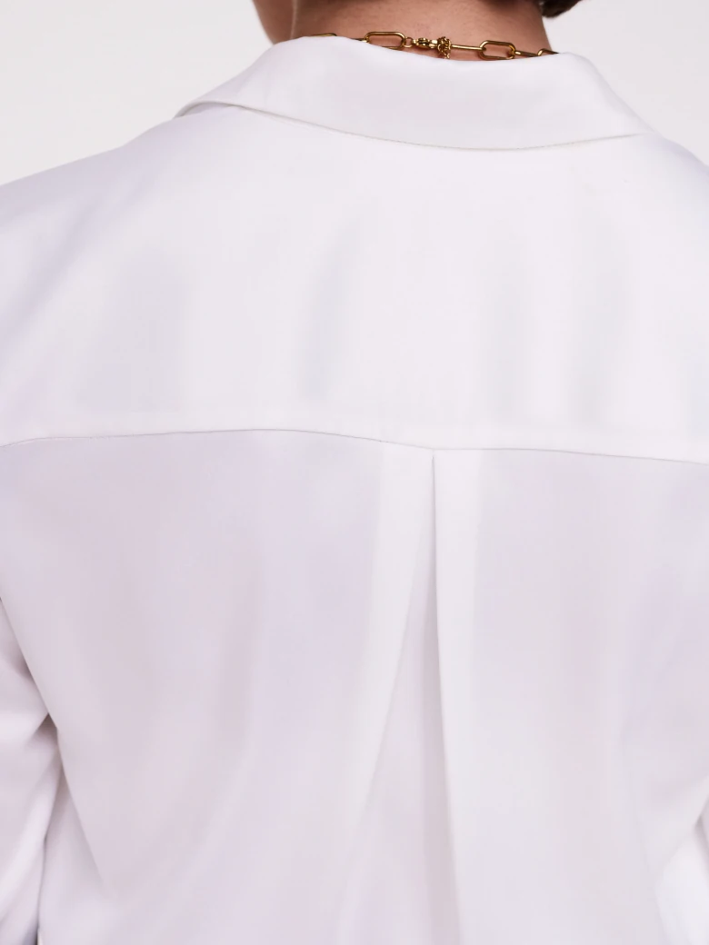Elegant white shirt with decorative buttons