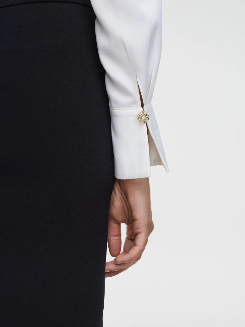 Elegant white shirt with decorative buttons