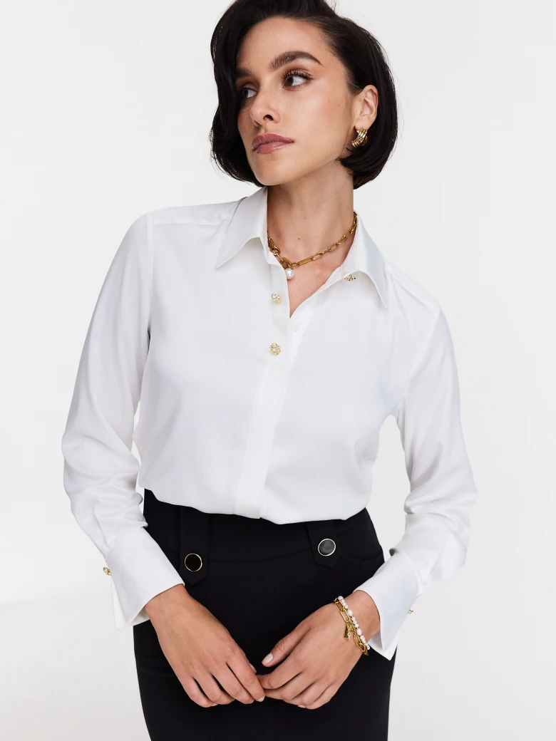 Elegant white shirt with decorative buttons