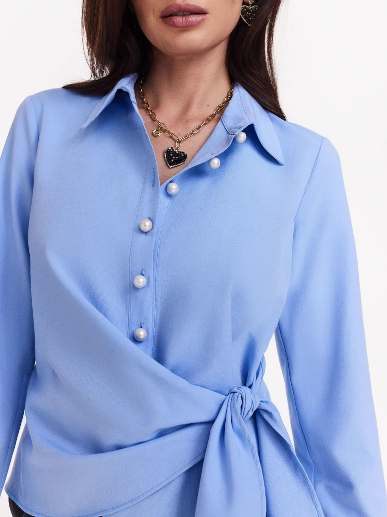 Blue shirt with binding and pearl buttons