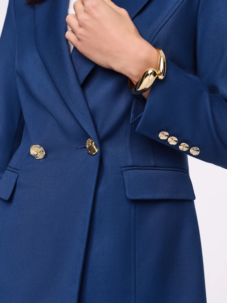 Navy blue jacket with gold buttons
