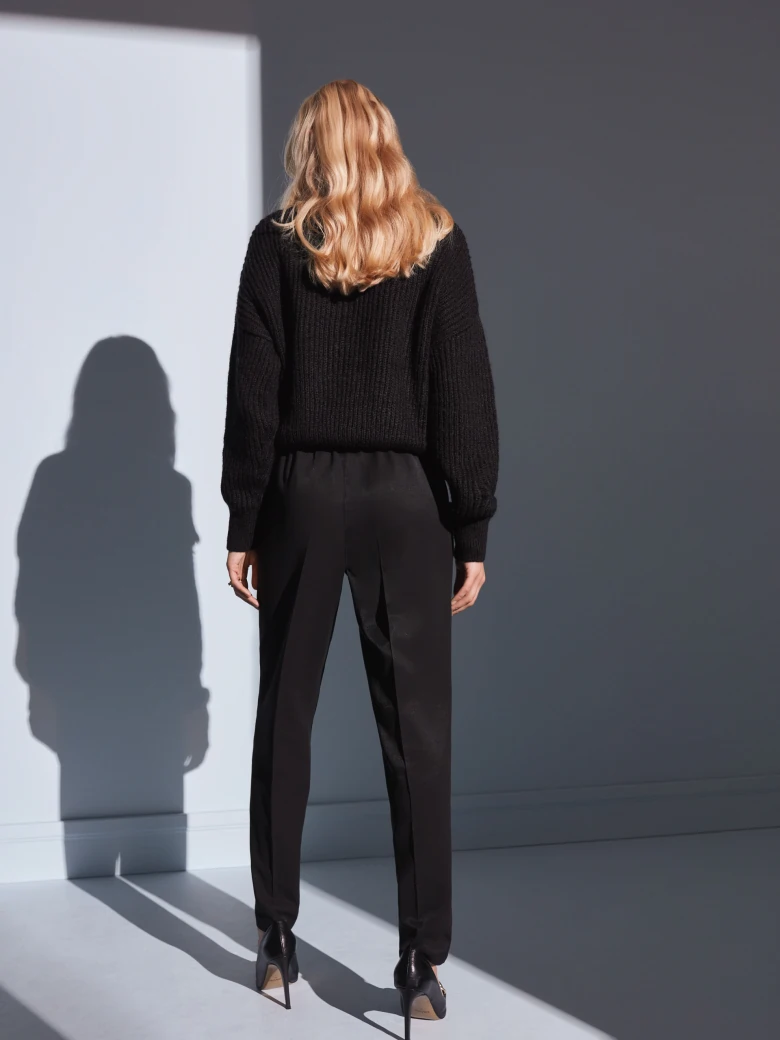 BLACK SWEATER WITH TASSELS