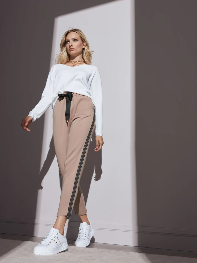 White sweater with a sweetheart neckline