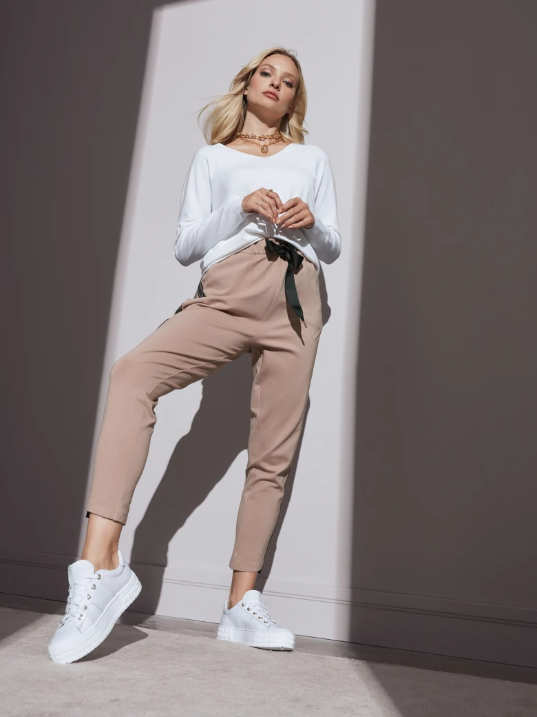 White sweater with a sweetheart neckline