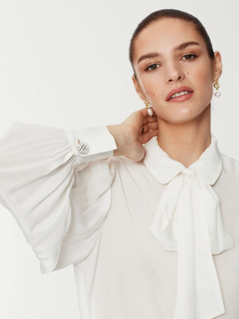 White tie-neck shirt