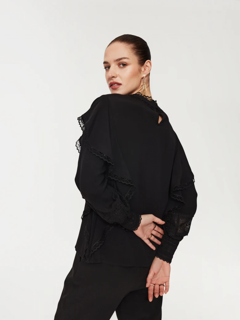 Black blouse with lace inserts