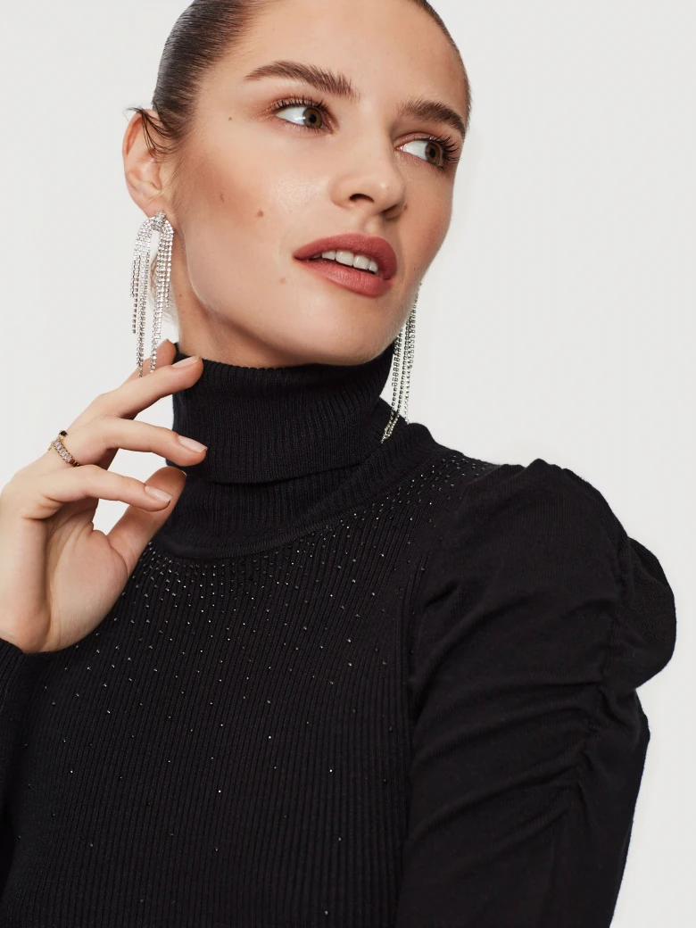 Knitted black dress with beads