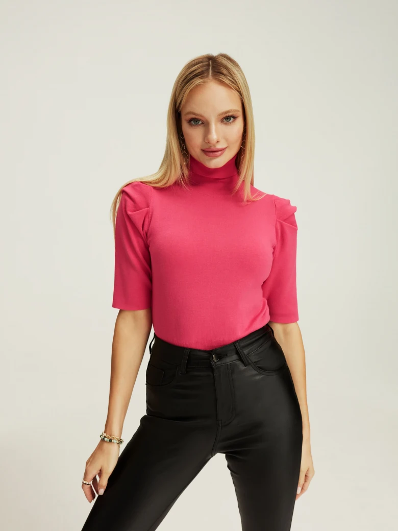 Pink turtleneck with buff sleeves