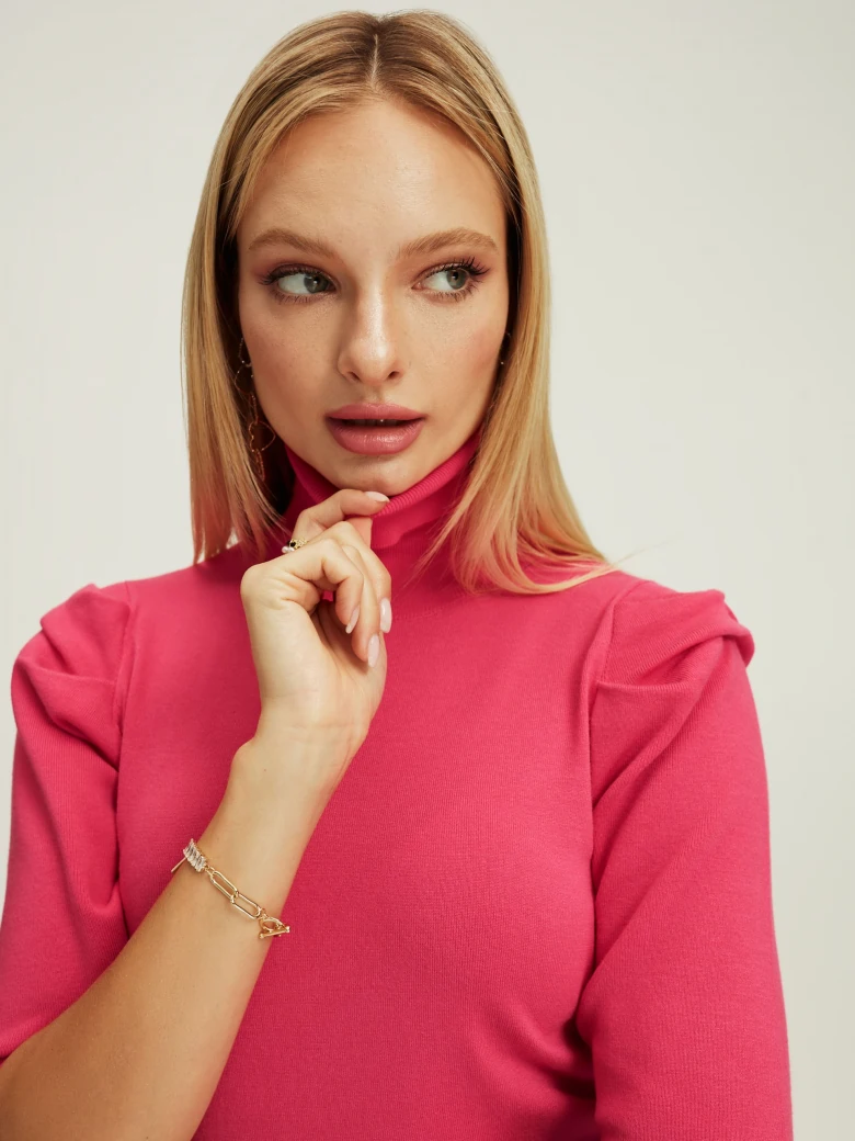 Pink turtleneck with buff sleeves