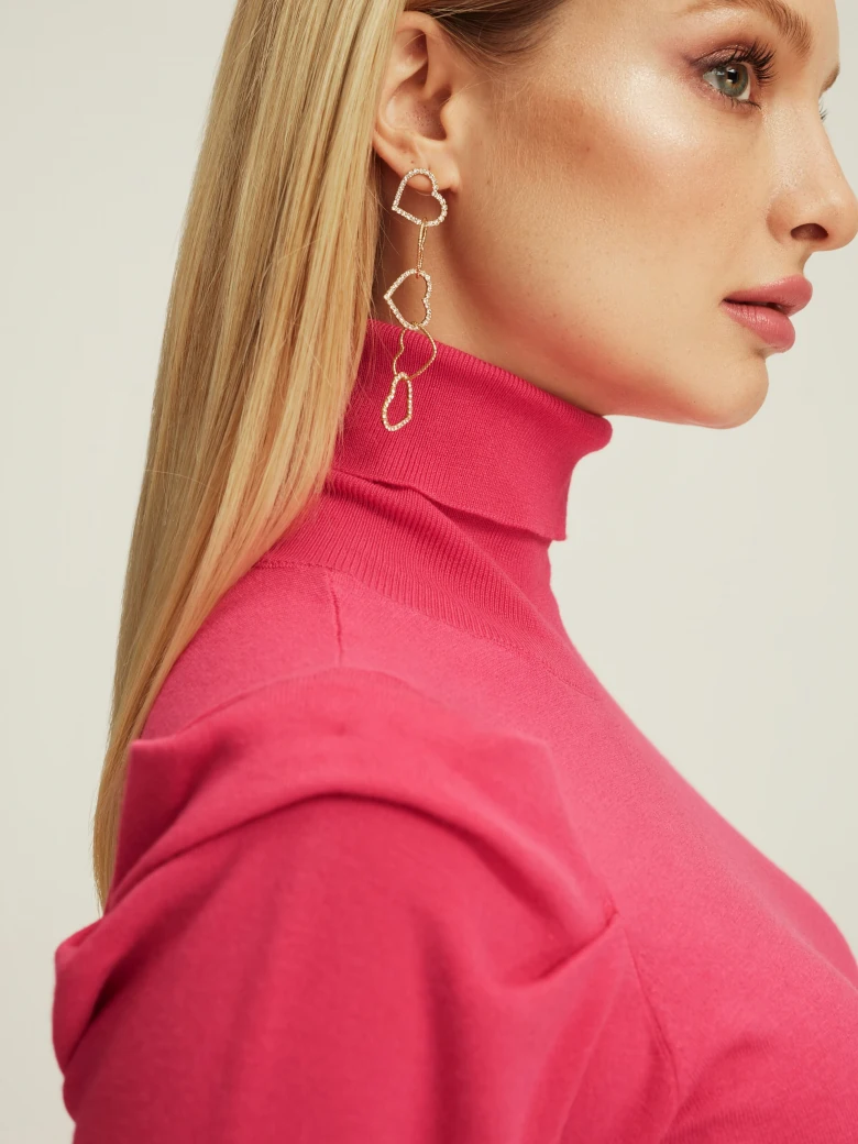 Pink turtleneck with buff sleeves