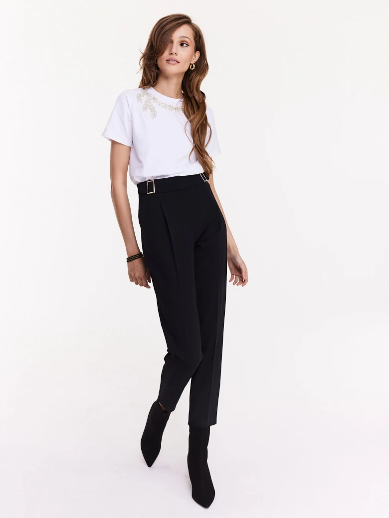 White blouse with short sleeves and decorative patch