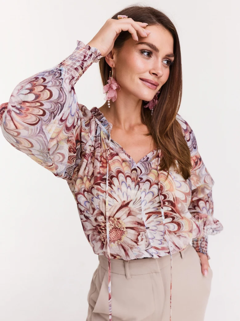 Bright floral shirt with binding at the neckline