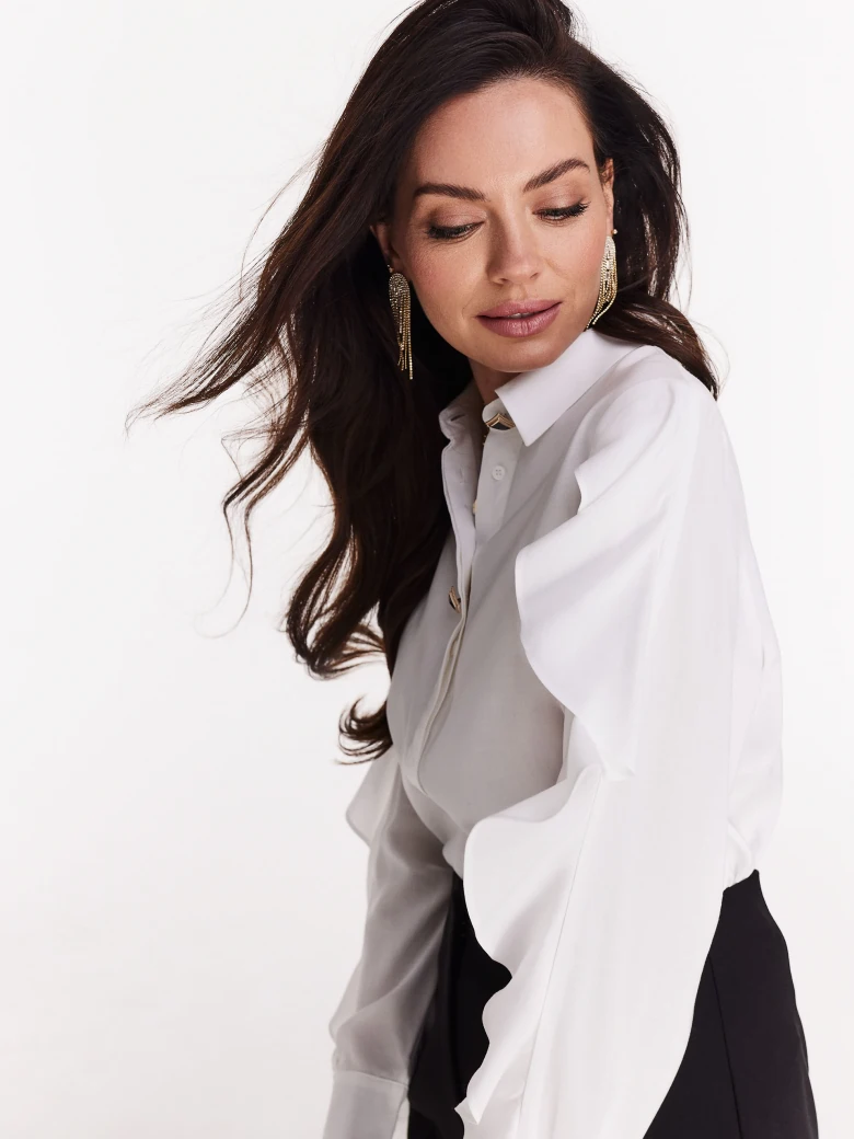 Elegant white shirt with ruffles on the sleeves