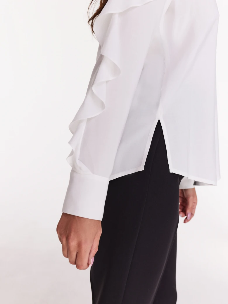 Elegant white shirt with ruffles on the sleeves