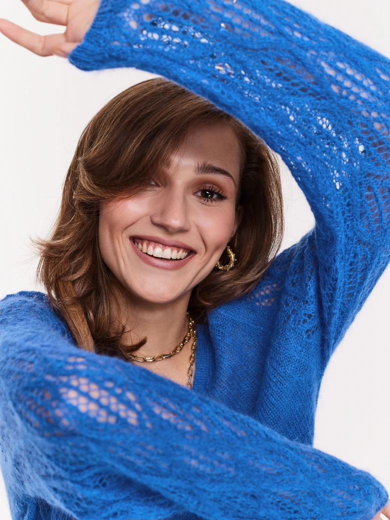 Blue sweater with openwork sleeves