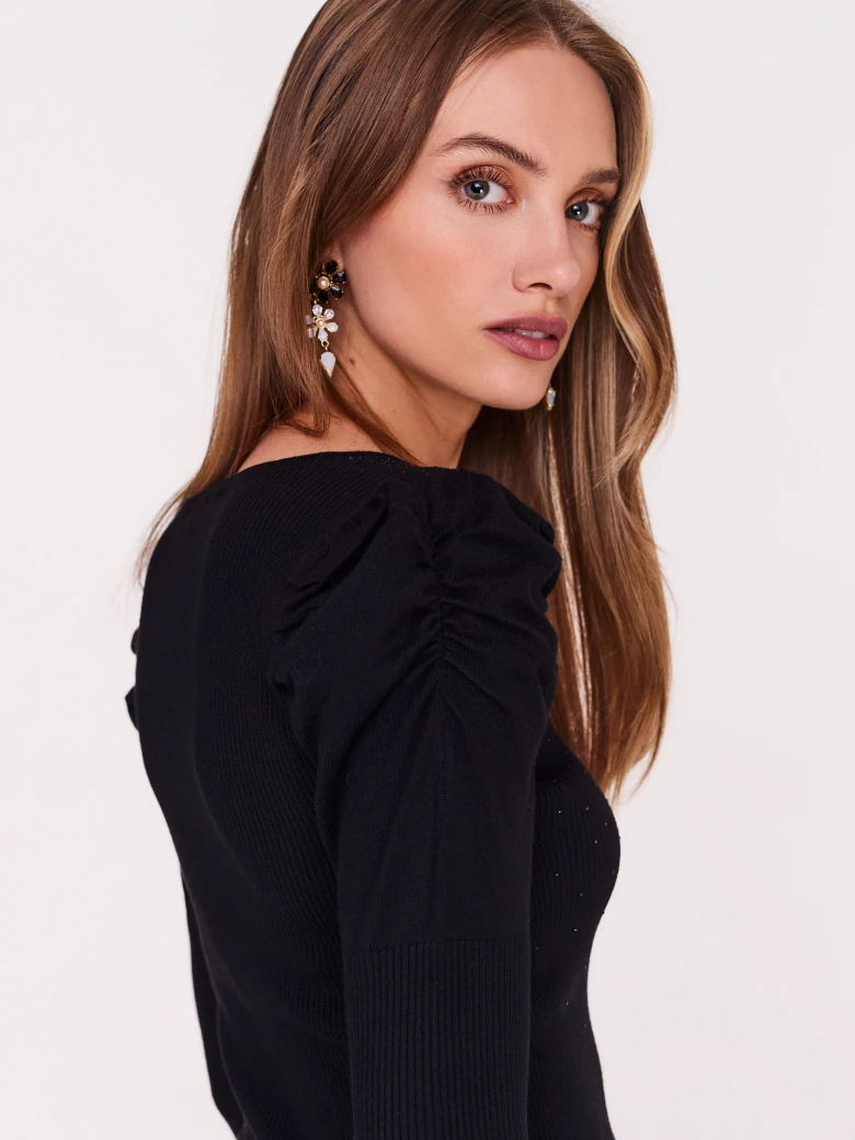 Black sweater with buffets and beads
