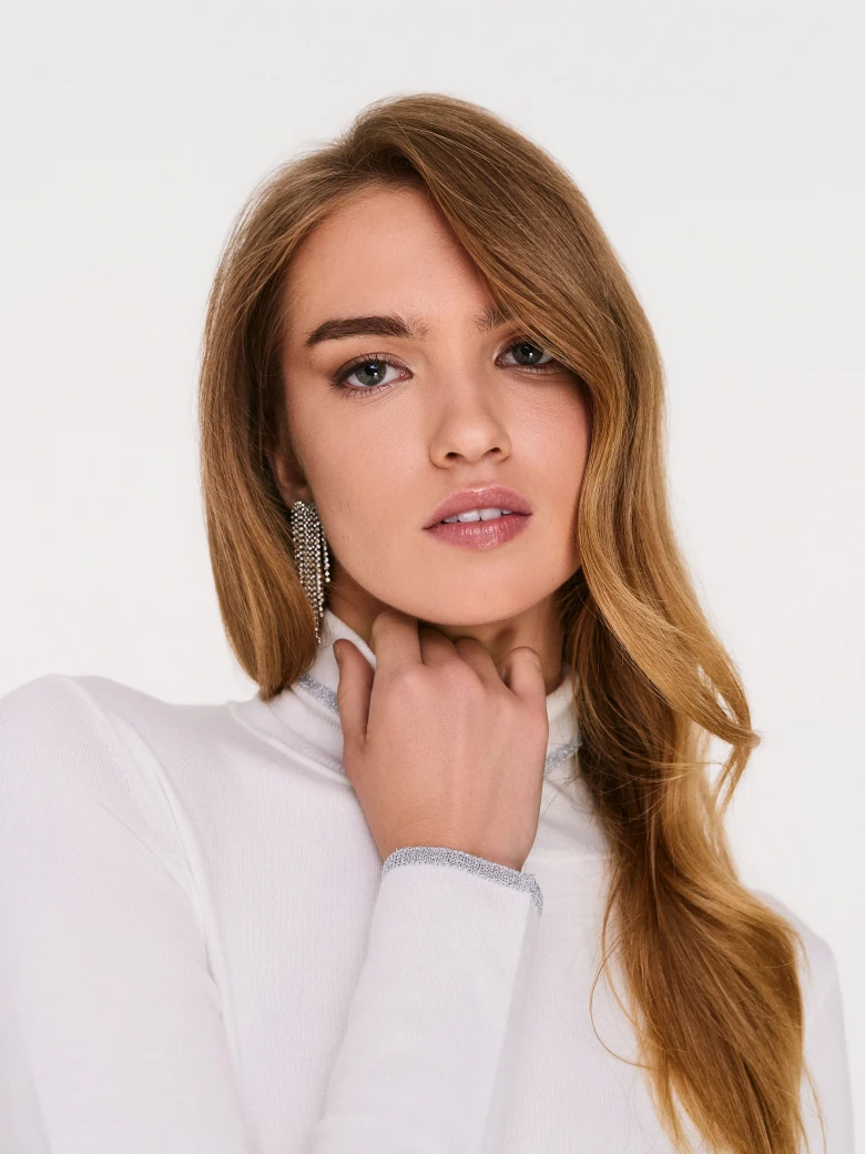 Fitted white turtleneck sweater