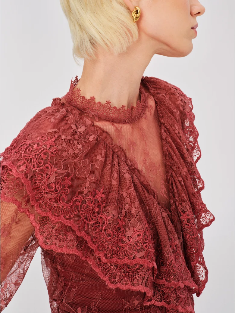 Lace blouse with brick-colored embellishments
