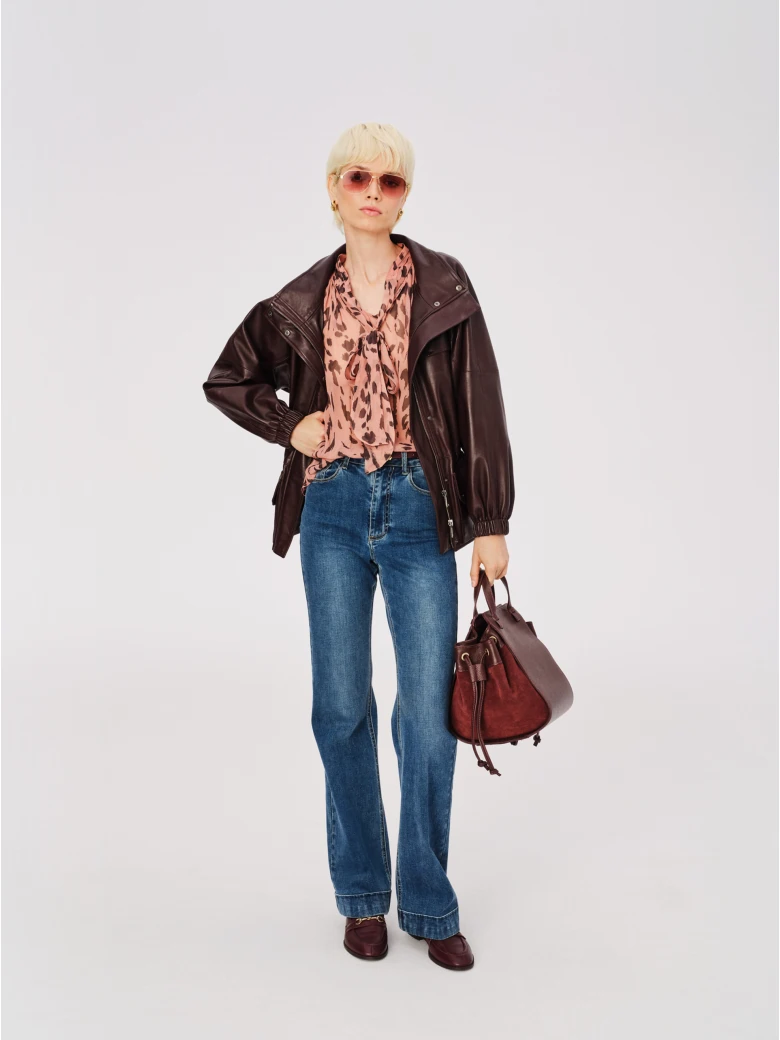 Airy pink spotted blouse with a tie at the neck