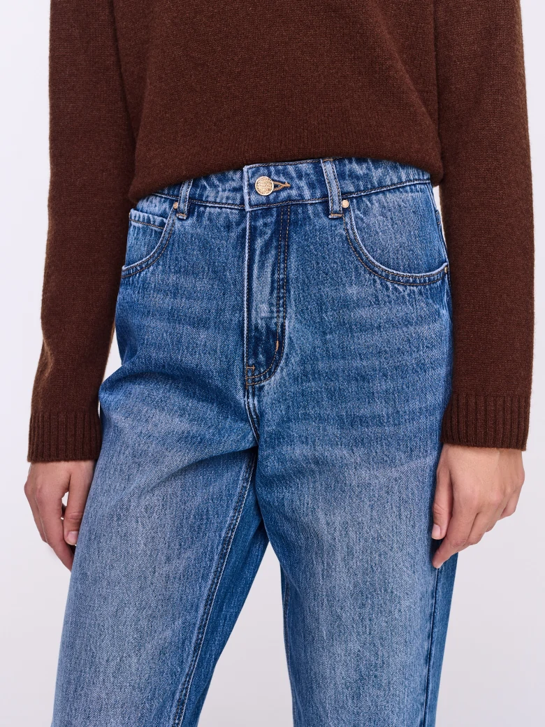 Blue distressed jeans with stitching