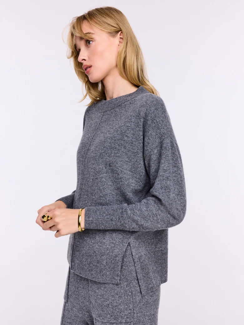 Loose gray sweater made of melange knit fabric