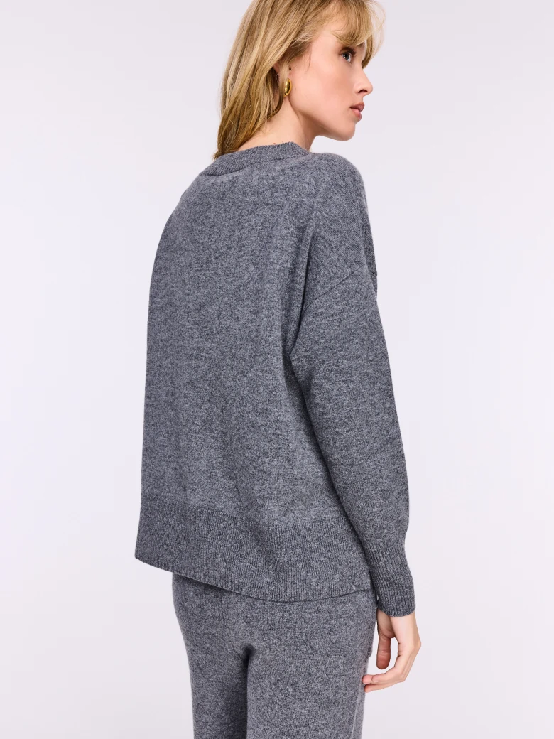 Loose gray sweater made of melange knit fabric