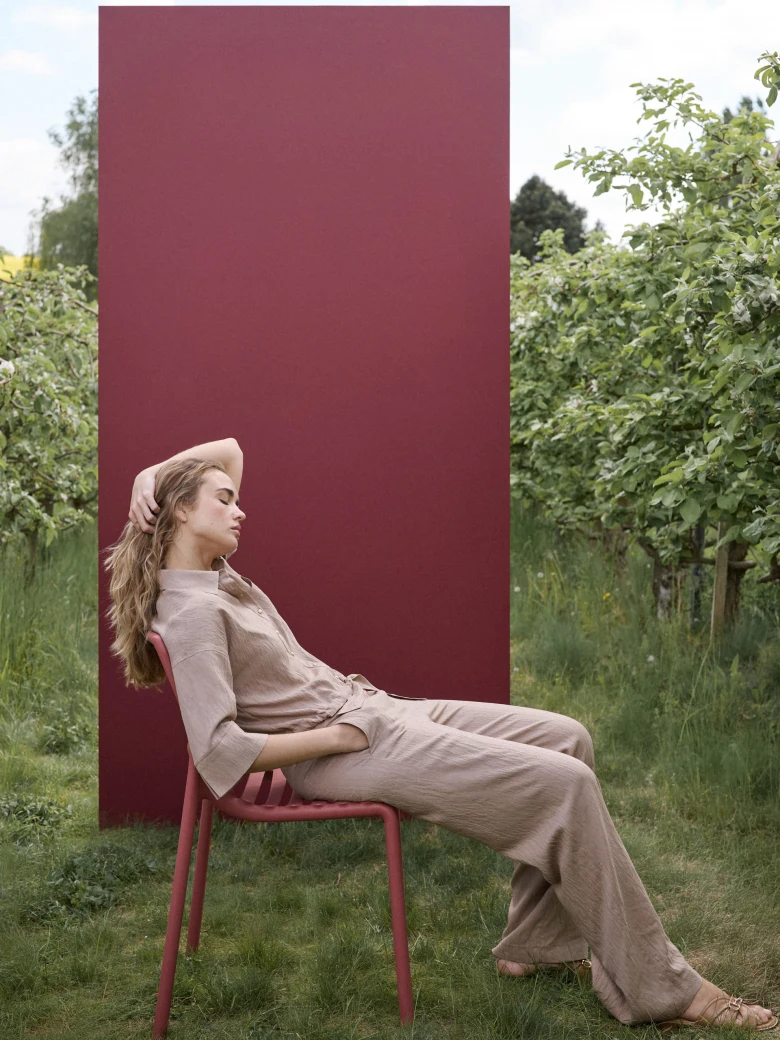 Beige high-waisted trousers with a subtle ribbed pattern