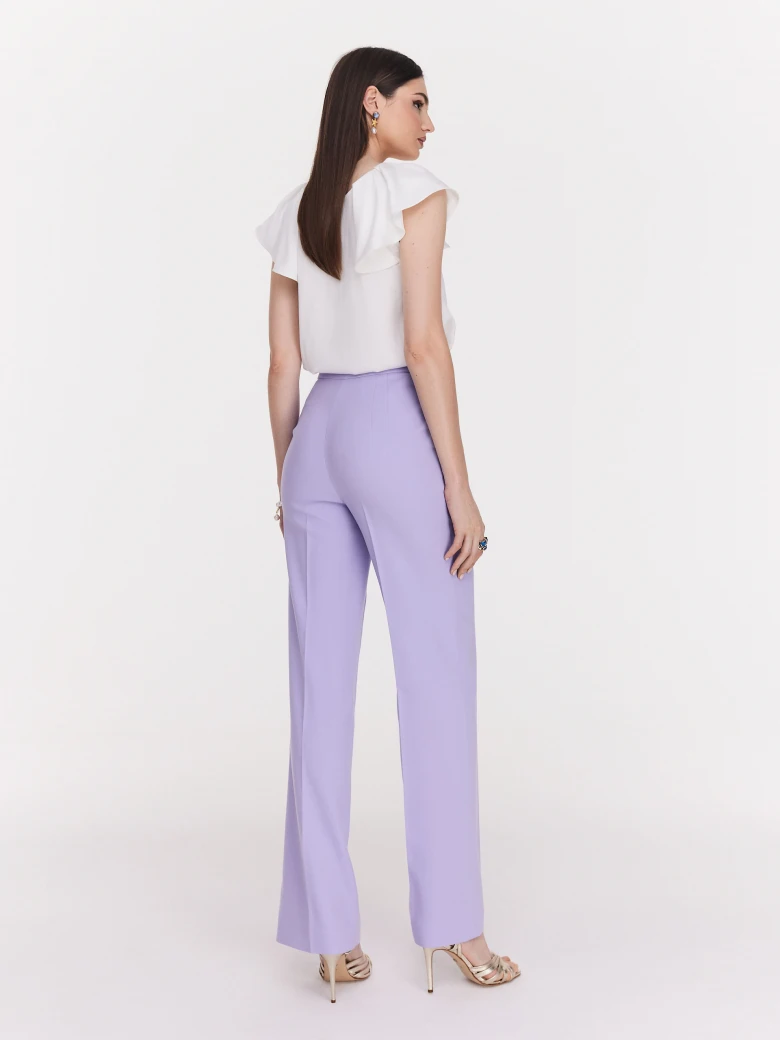 Loose white blouse with ruffle