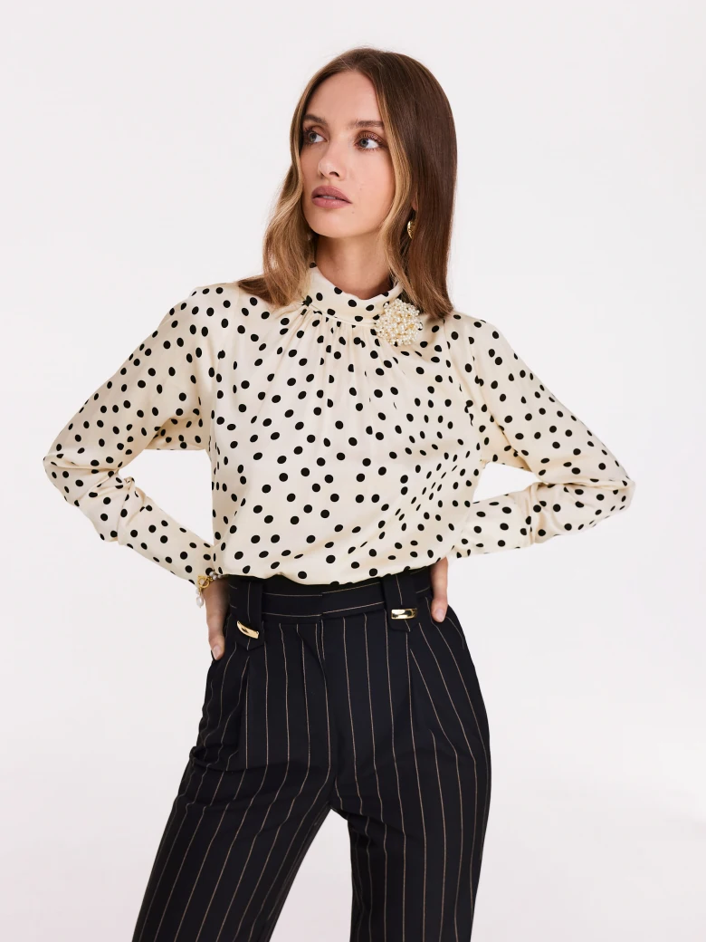 Cream pea blouse with pearl brooch