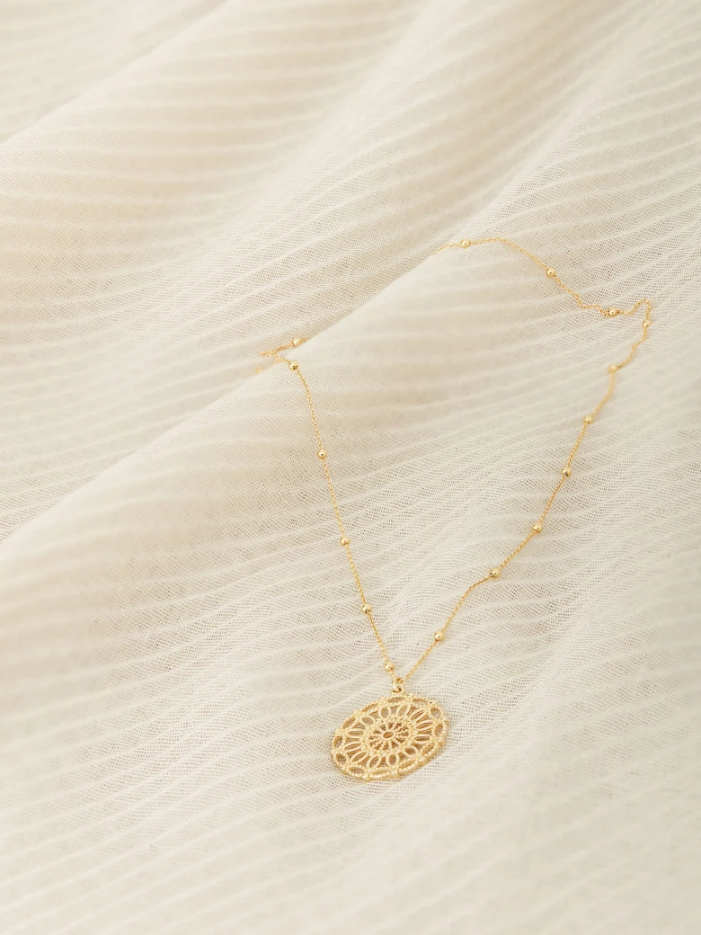 NECKLACE WITH OPENWORK CHARM