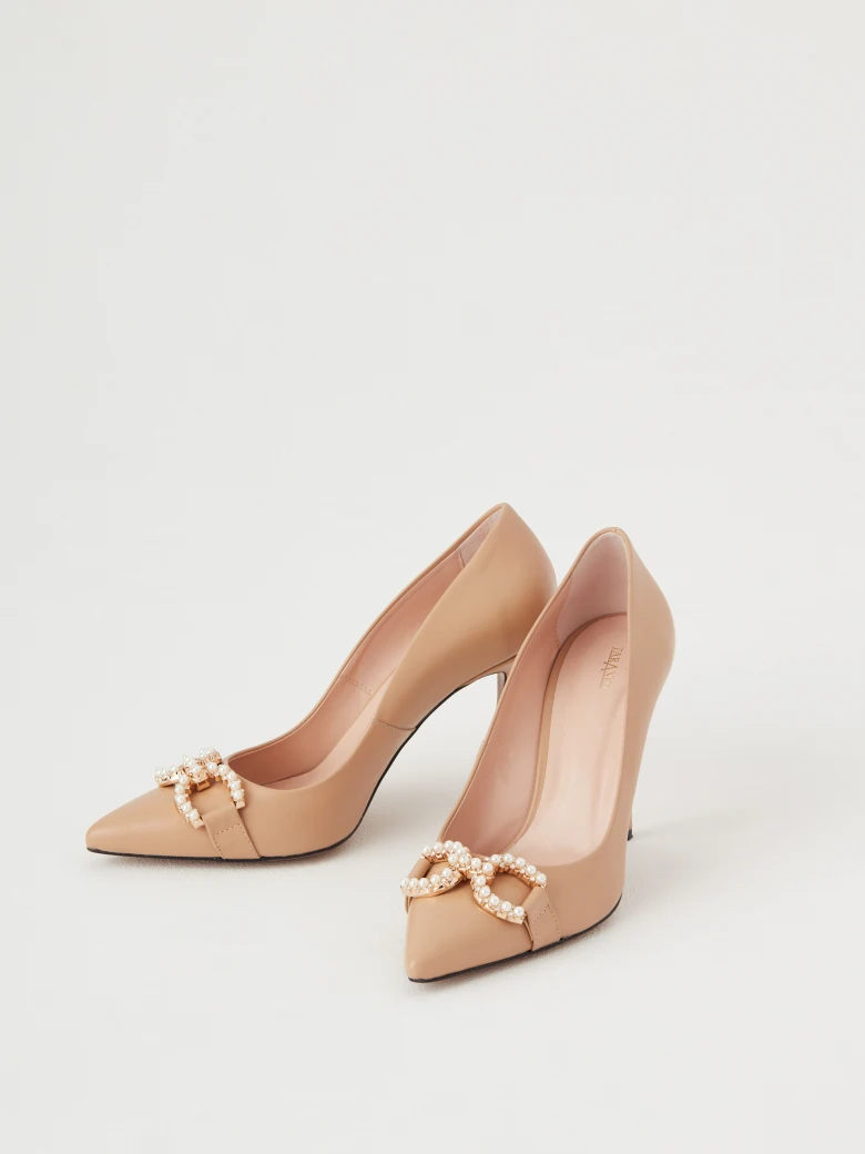 Beige leather pumps