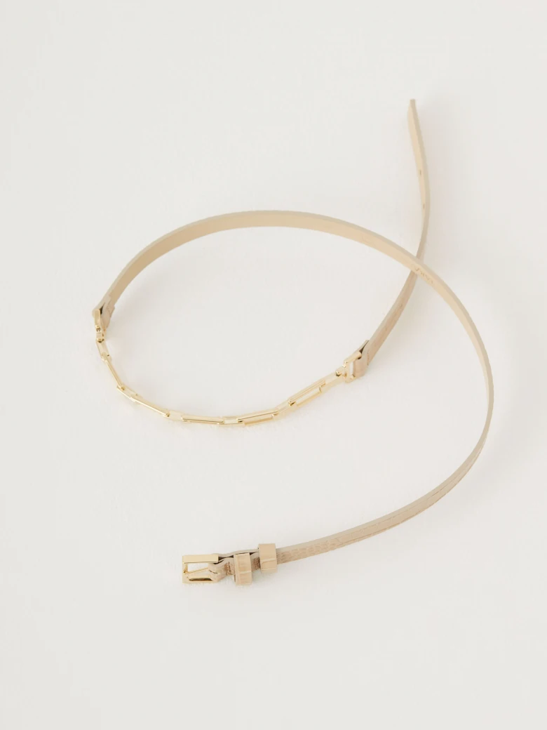 Narrow beige belt with crocodile leather texture