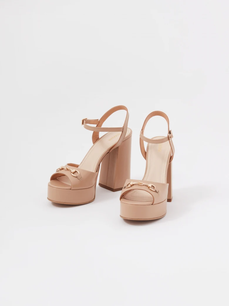 Beige leather platform sandals with buckle detailing