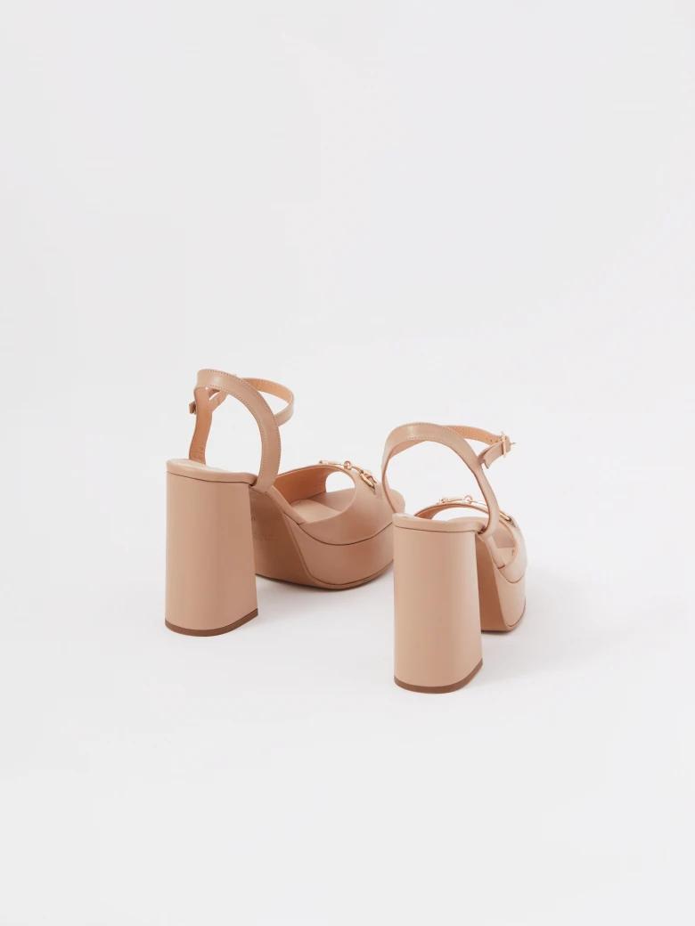 Beige leather platform sandals with buckle detailing