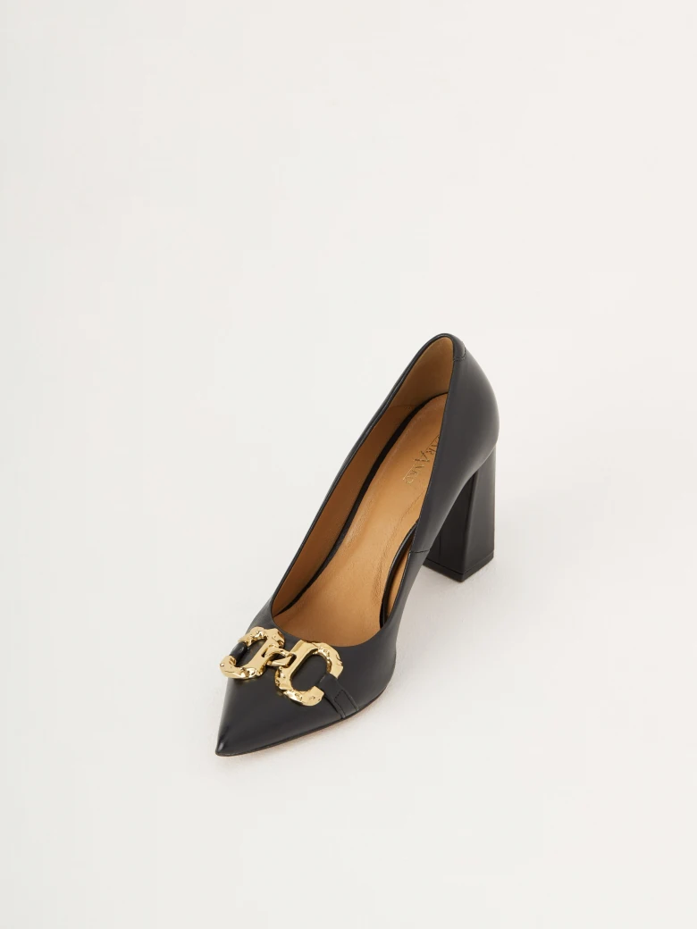 Black heels with golden buckle