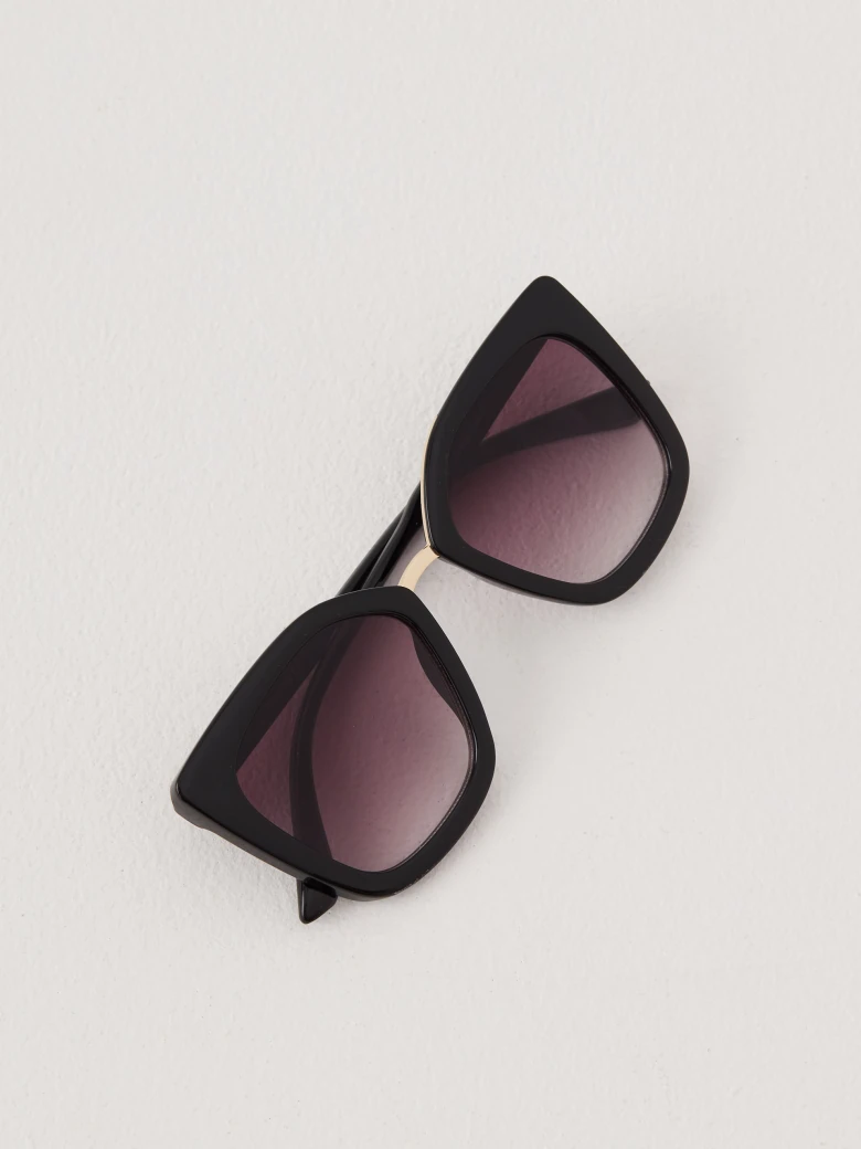 Black sunglasses with decorative inserts