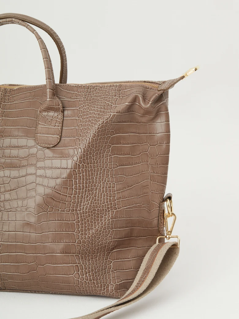 Beige travel bag with crocodile texture