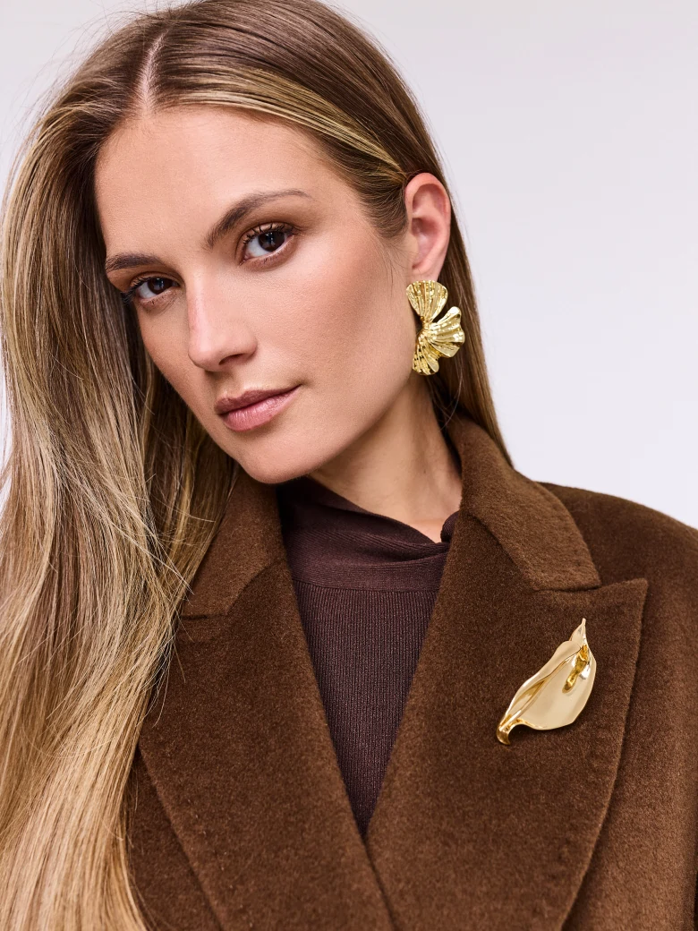 Gold-colored leaf-shaped brooch