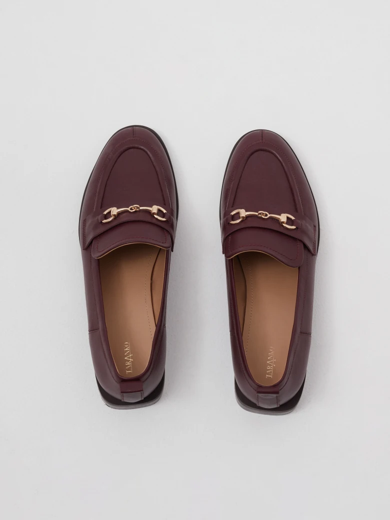 Burgundy leather moccasins with metal buckles