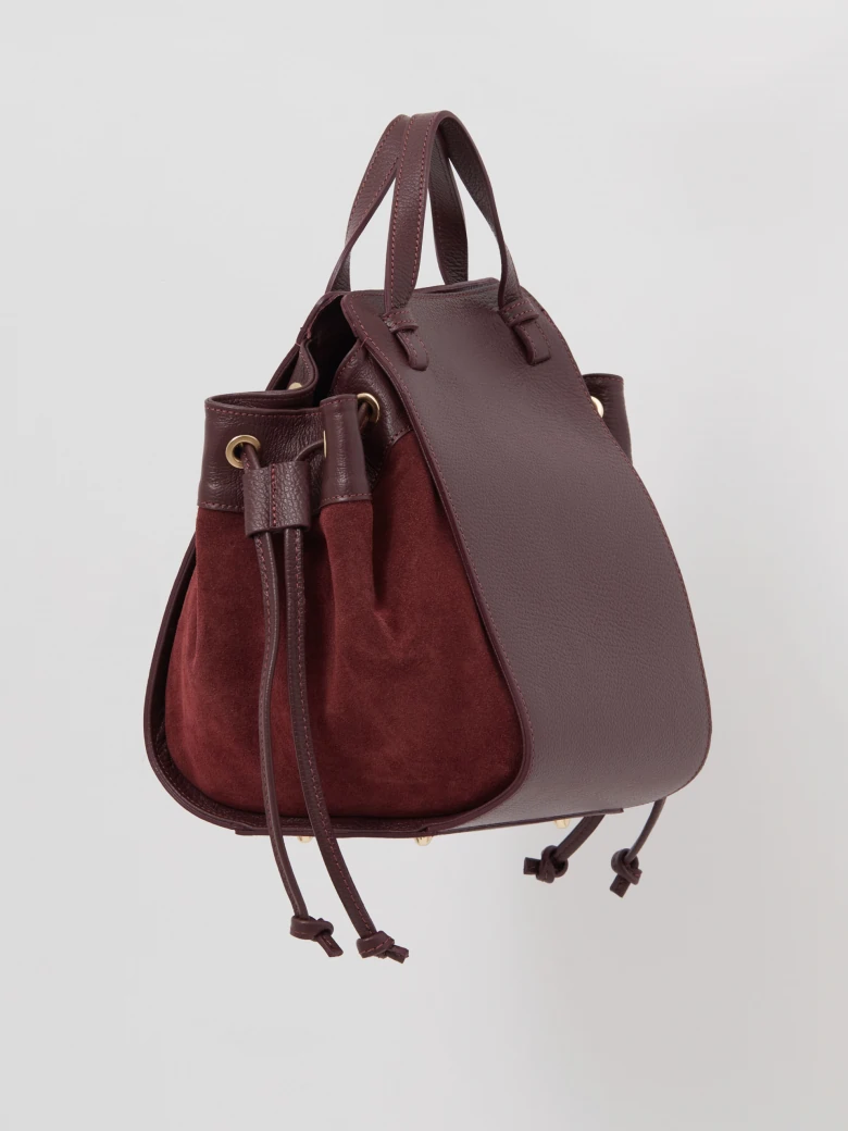 Burgundy leather handbag made of mixed materials